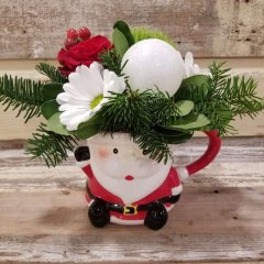 Flower arrangement in a santa mug great gift for the holidays and christmas